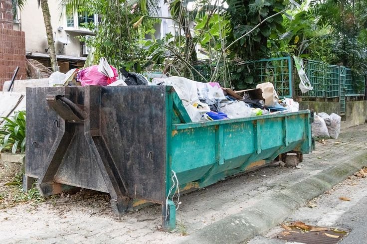 rubbish dumspter or roro bin with load of waste from construction debris